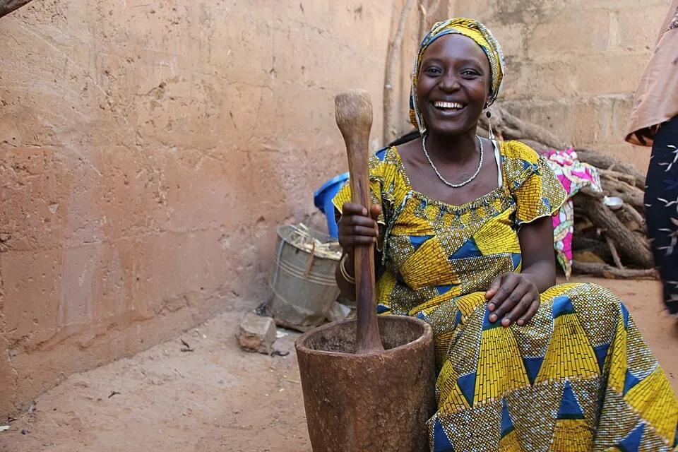 A smiling woman in her community